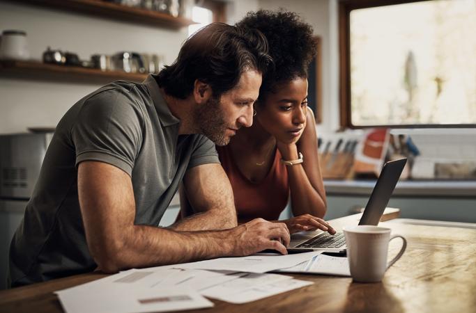 Couple sitting at a table reviewing options