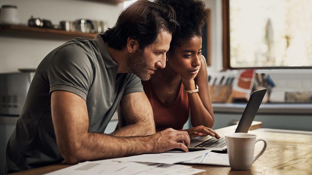 Couple sitting at a table reviewing options